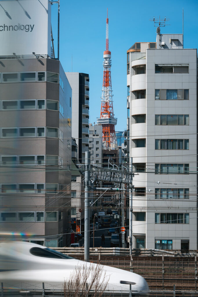 Shinkansen passing by in front of the Tokyo Tower