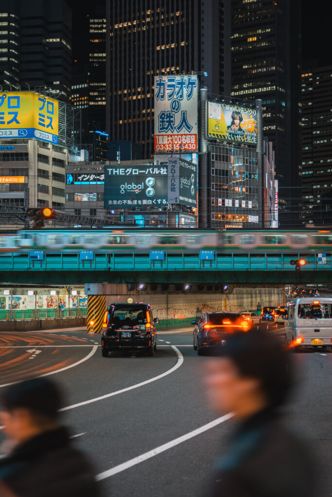 Shinjuku trains and neon by night