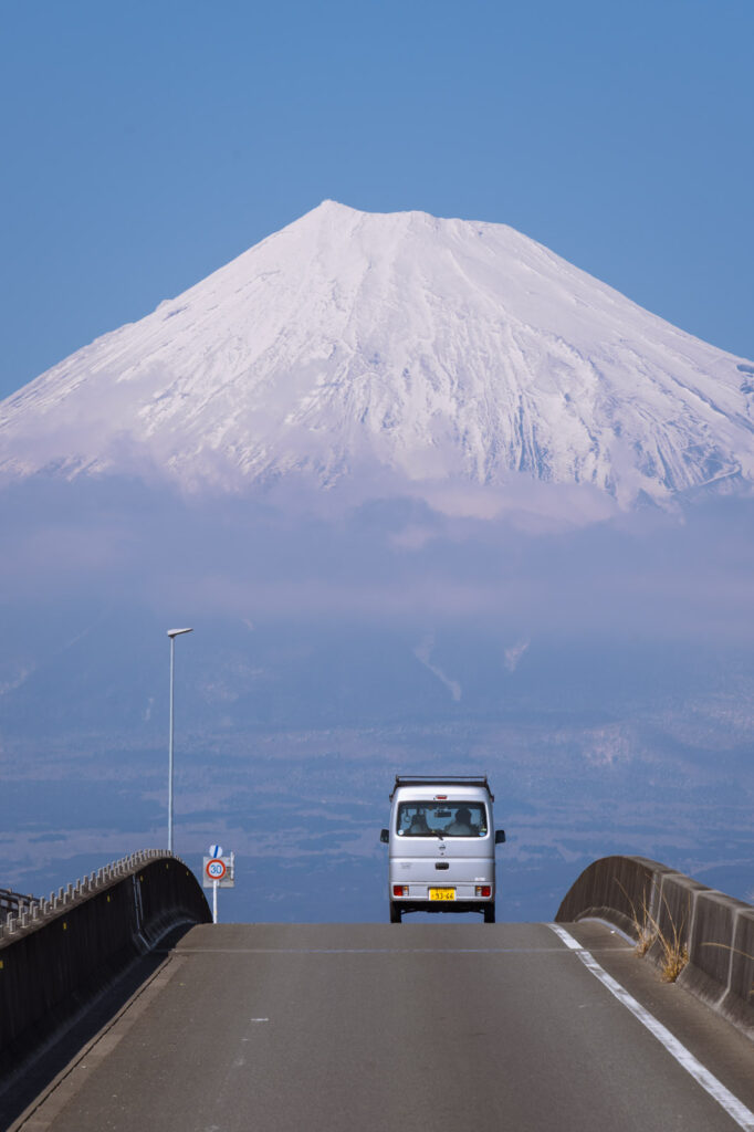 Car driving towards Mount Fuji