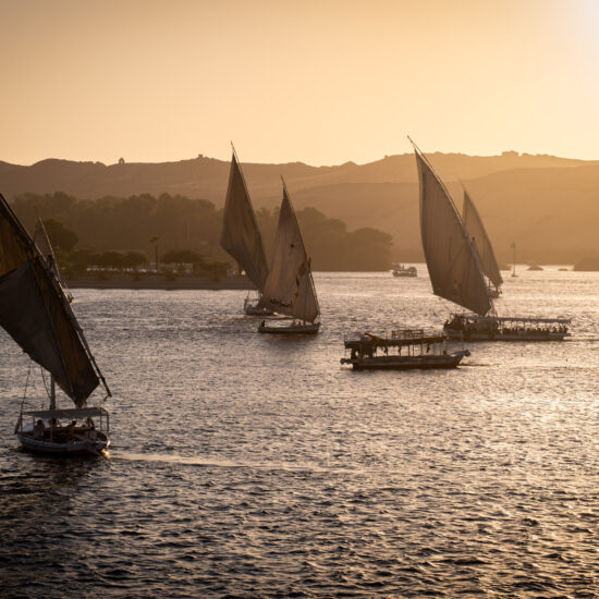 Traditional Feluccas on the nile in Aswan during sunset