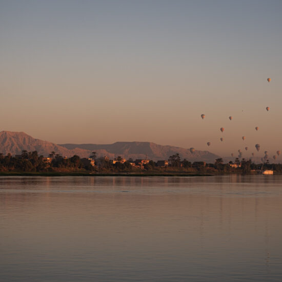 Hot air balloons over the Nile in Luxor during sunrise